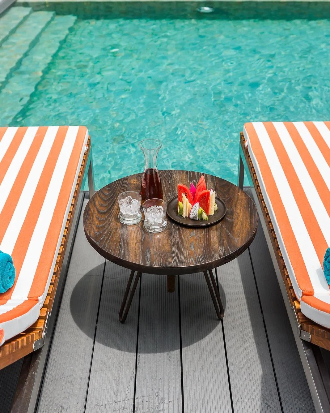 Poolside deck and striped loungers at Hotel Vista Pattaya